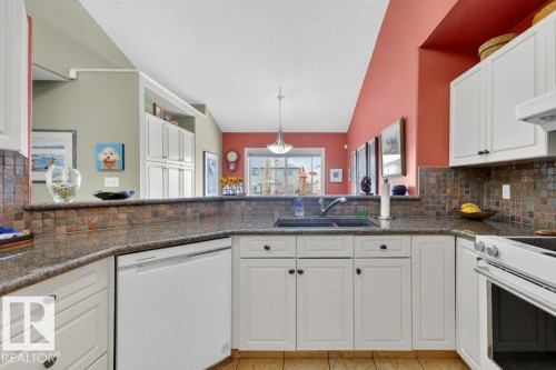 11686 15 Avenue, Edmonton, AB - Indoor Photo Showing Kitchen With Double Sink