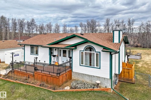 Ranch-style residence featuring white siding and green trim - 8 54514 Rr12, Rural Lac Ste. Anne County, AB - Outdoor
