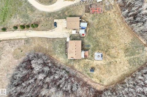 Expansive property featuring two residential structures, a gravel driveway, and a large open yard area - 8 54514 Rr12, Rural Lac Ste. Anne County, AB - Outdoor With View