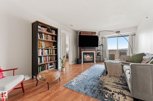 311 9640 105 Street, Edmonton, AB - Indoor Photo Showing Living Room With Fireplace