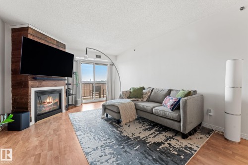 311 9640 105 Street, Edmonton, AB - Indoor Photo Showing Living Room With Fireplace
