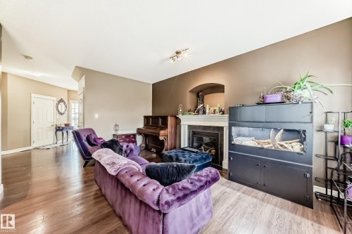 26 South Creek Wynd, Stony Plain, AB - Indoor Photo Showing Living Room With Fireplace