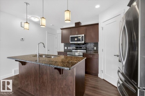 20315 43 Avenue, Edmonton, AB - Indoor Photo Showing Kitchen With Stainless Steel Kitchen With Double Sink With Upgraded Kitchen