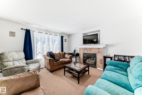 115 60 Street, Edmonton, AB - Indoor Photo Showing Living Room With Fireplace