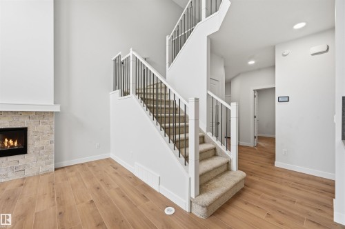 3048 Dixon Landing Landing, Edmonton, AB - Indoor Photo Showing Other Room With Fireplace