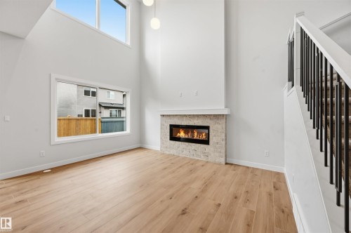3048 Dixon Landing Landing, Edmonton, AB - Indoor Photo Showing Living Room With Fireplace