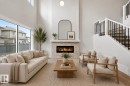 Virtually staged - 3048 Dixon Landing Landing, Edmonton, AB  - Indoor Photo Showing Living Room With Fireplace 