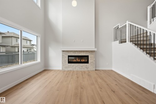 3048 Dixon Landing Landing, Edmonton, AB - Indoor Photo Showing Living Room With Fireplace