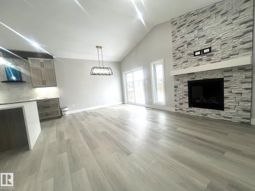 261 Meadowview Drive, Fort Saskatchewan, AB - Indoor Photo Showing Living Room With Fireplace