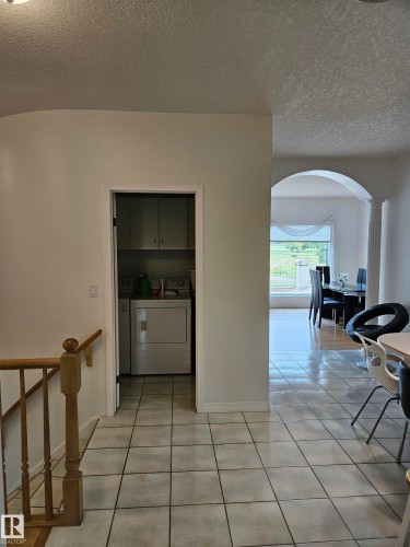 Towards the laundry room, with the dining room and the living room just up ahead - 4317 53 Street, St. Paul Town, AB - Indoor Photo Showing Other Room