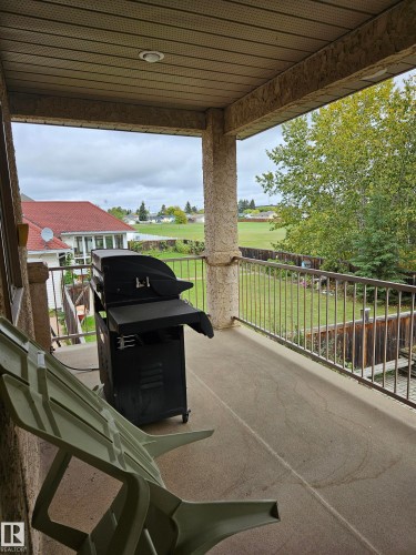 Rear deck overlooking the back yard, from kitchen - 4317 53 Street, St. Paul Town, AB - Outdoor With Deck Patio Veranda With Exterior