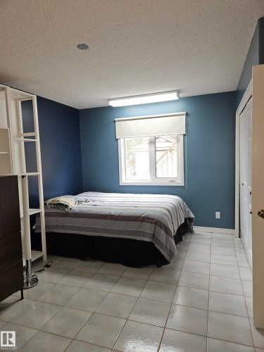 main floor bedroom, totalling 4 BR - 4317 53 Street, St. Paul Town, AB - Indoor Photo Showing Bedroom