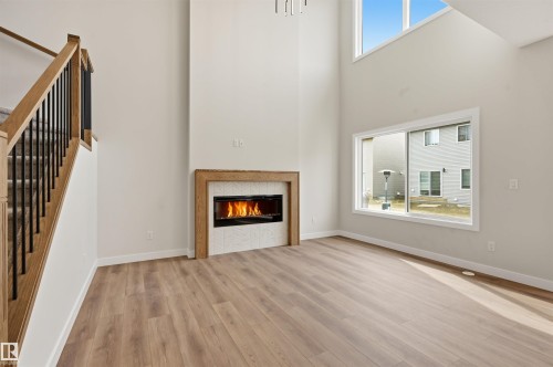 3218 Dixon Way, Edmonton, AB - Indoor Photo Showing Living Room With Fireplace