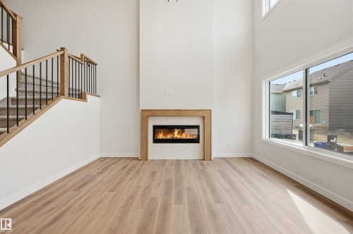 3218 Dixon Way, Edmonton, AB - Indoor Photo Showing Other Room With Fireplace