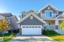Two-story residence featuring a gray shake and beige horizontal siding exterior - 6864 Evans Wynd, Edmonton, AB  - Outdoor With Facade 