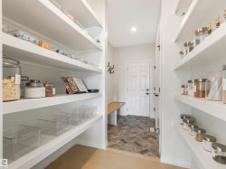 The property features extensive built-in shelving, providing ample storage space - 