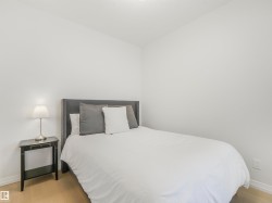 This room features light-colored flooring, white walls, and a recessed ceiling light - 