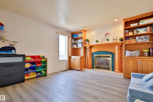 8710 156A Avenue, Edmonton, AB - Indoor Photo Showing Living Room With Fireplace