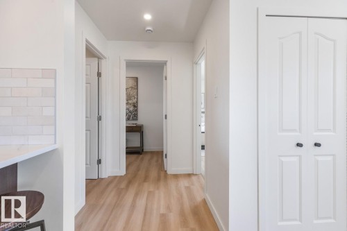 Hallway with light wood-finish flooring, white walls, and recessed lighting - 4508 109A Avenue, Edmonton, AB - Indoor Photo Showing Other Room