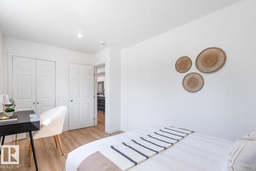 Bright room with light wood-finish flooring, white walls, and a recessed ceiling light - 4508 109A Avenue, Edmonton, AB - Indoor Photo Showing Bedroom