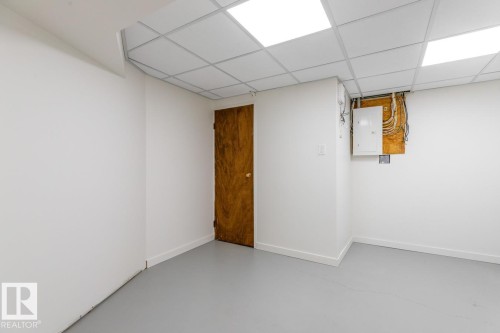 Room with light gray flooring and white baseboards - 4508 109A Avenue, Edmonton, AB - Indoor