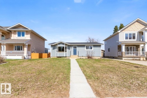 Single-story residence featuring light blue siding with white trim - 4508 109A Avenue, Edmonton, AB - Outdoor With Deck Patio Veranda With Facade