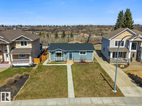 Single-story residence featuring blue siding and white trim - 4508 109A Avenue, Edmonton, AB - Outdoor With Facade