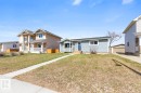 Single-story residence featuring blue siding and white trim - 4508 109A Avenue, Edmonton, AB  - Outdoor With Facade 