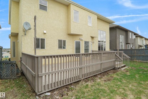 Spacious rear deck featuring wood railings and stairs, offering outdoor living space - 6823 18 Avenue, Edmonton, AB - Outdoor With Exterior