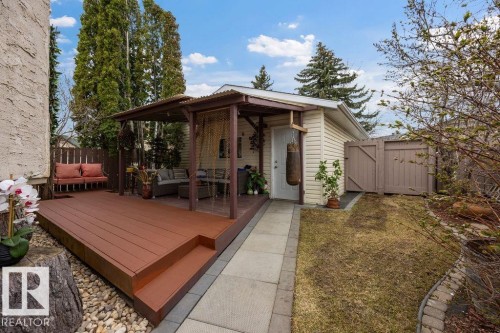 Multi-level wood-finish deck featuring a covered pergola - 7422 188 Street, Edmonton, AB - Outdoor