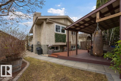 Exterior stucco finish with a prominent chimney - 7422 188 Street, Edmonton, AB - Outdoor