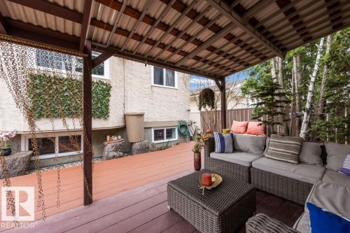 Expansive covered deck featuring wood-finish flooring and a corrugated roof - 7422 188 Street, Edmonton, AB - Outdoor With Deck Patio Veranda With Exterior
