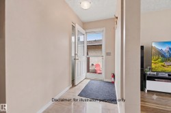 Entryway with light-toned walls and a white door featuring a glass panel - 