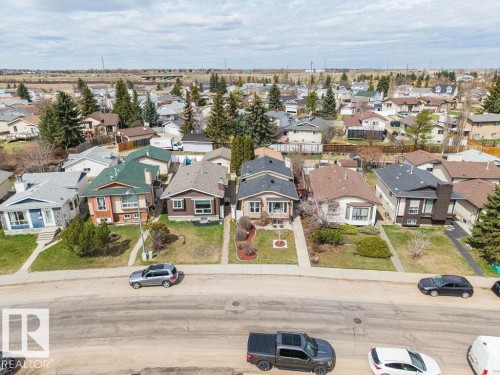 Residential neighborhood featuring a mix of architectural styles, established landscaping, and paved streets - 7422 188 Street, Edmonton, AB - Outdoor With View
