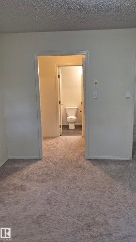 114 2430 Guardian Road, Edmonton, AB - Indoor Photo Showing Other Room