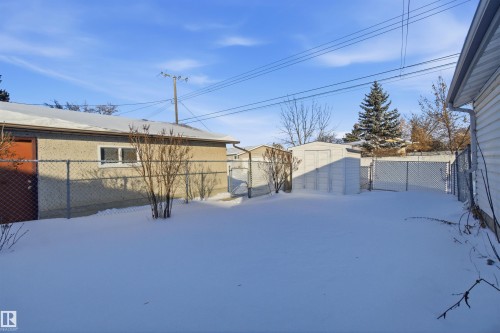The property includes a detached garage and a white storage shed - 5208 90 Avenue, Edmonton, AB - Outdoor
