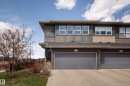 Contemporary multi-story exterior with a two-car garage, stone accents, and varied siding textures - 2704 Koshal Place, Edmonton, AB  - Outdoor 