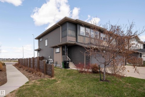 Multi-level property with dark gray siding and lighter accent panels - 2704 Koshal Place, Edmonton, AB - Outdoor