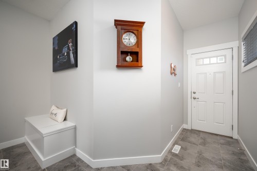 Entryway featuring gray tile flooring, white baseboards, and light gray wall paint - 2704 Koshal Place, Edmonton, AB - Indoor Photo Showing Other Room