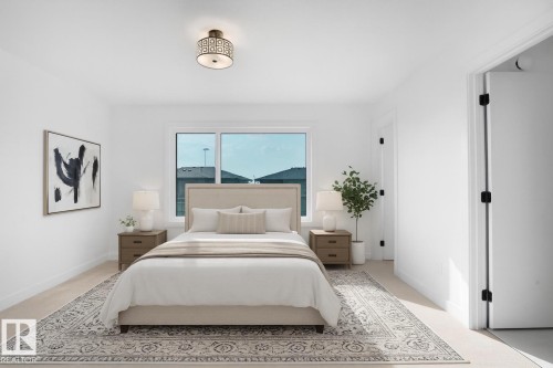 Spacious bedroom featuring light-toned flooring, white walls, and a large window - 86 Blackbird Bend, Fort Saskatchewan, AB - Indoor Photo Showing Bedroom