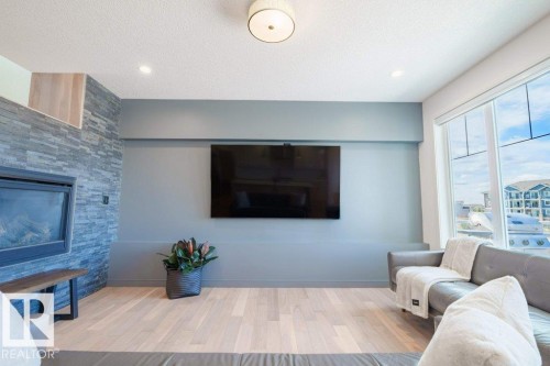 3386 Cutler Crescent, Edmonton, AB - Indoor Photo Showing Living Room With Fireplace