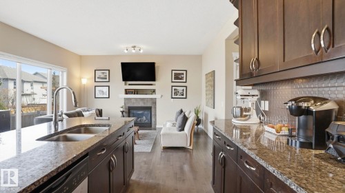 37 Codette Way, Sherwood Park, AB - Indoor Photo Showing Kitchen With Fireplace With Double Sink