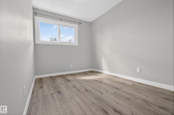 Neutral gray walls complemented by wood-finish flooring - 