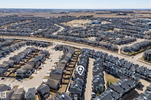 Aerial perspective of a residential neighborhood with varied housing styles - 61 2803 James Mowatt Trail, Edmonton, AB - Outdoor With View