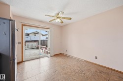 Tiled flooring extending to a sliding glass patio door - 