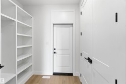 Built-in shelving and cabinetry with matte black hardware - 