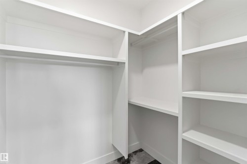 Walk in closet - 415 Pine Point(E), Leduc, AB - Indoor With Storage