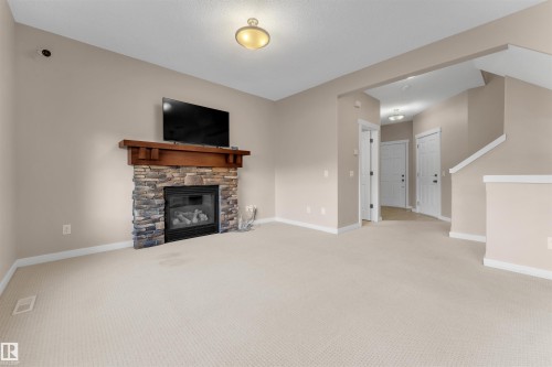 3650 13 Street, Edmonton, AB - Indoor Photo Showing Other Room With Fireplace
