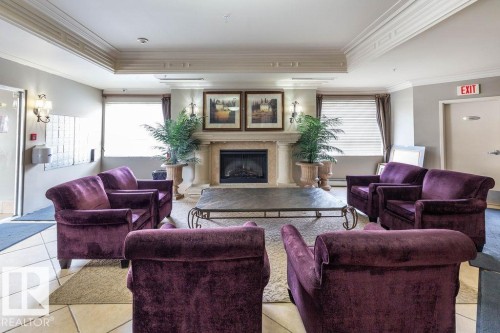 301 9707 105 Street, Edmonton, AB - Indoor Photo Showing Living Room With Fireplace