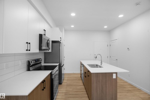 #101 3715 141 St Sw, Edmonton, AB - Indoor Photo Showing Kitchen With Double Sink